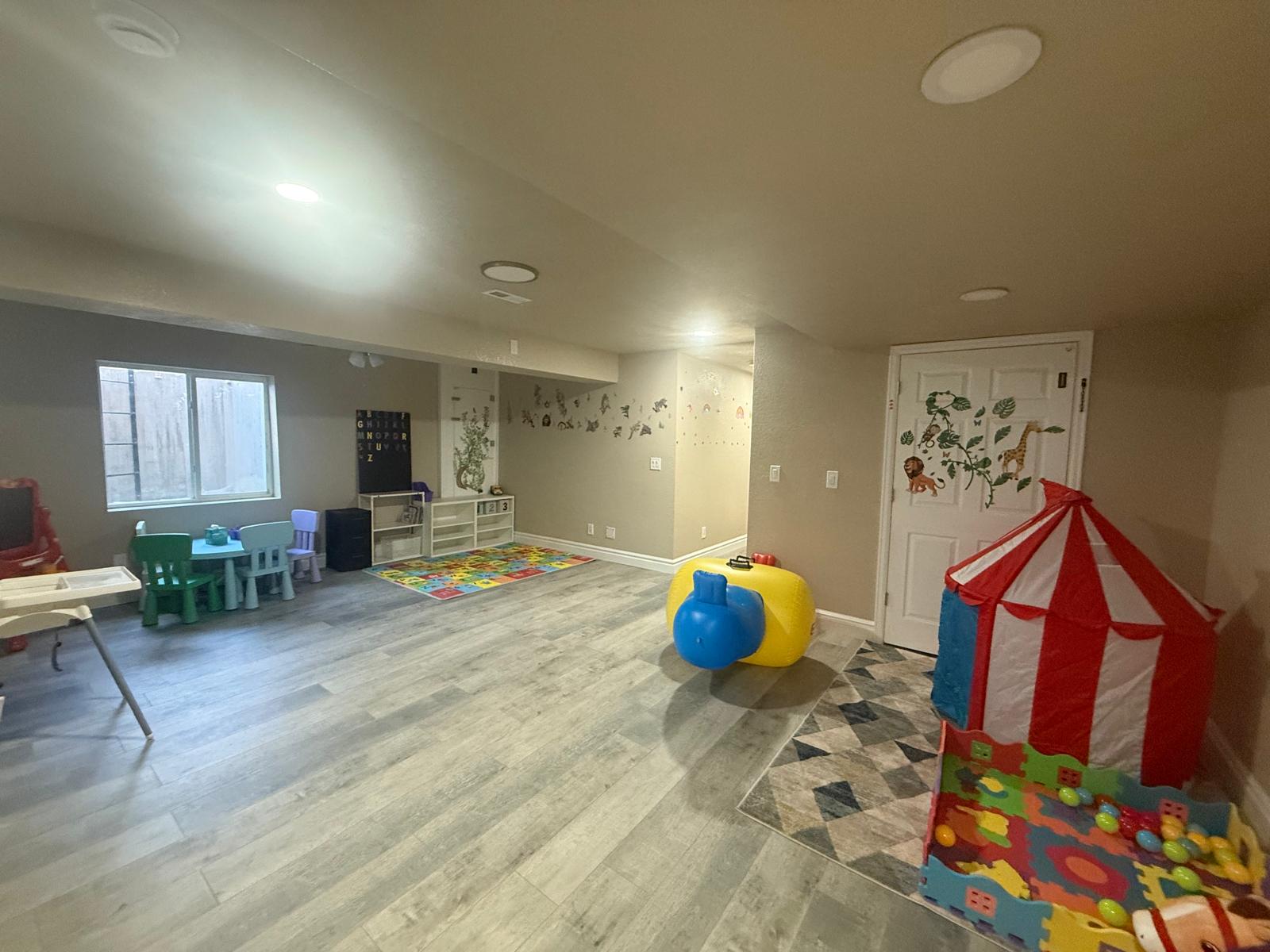 Teacher and toddler playing with math puzzle